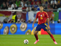 Rodrigo Hernandez defensive midfield of Spain and Manchester City during the UEFA EURO 2024 group stage match between Spain and Italy at Are...