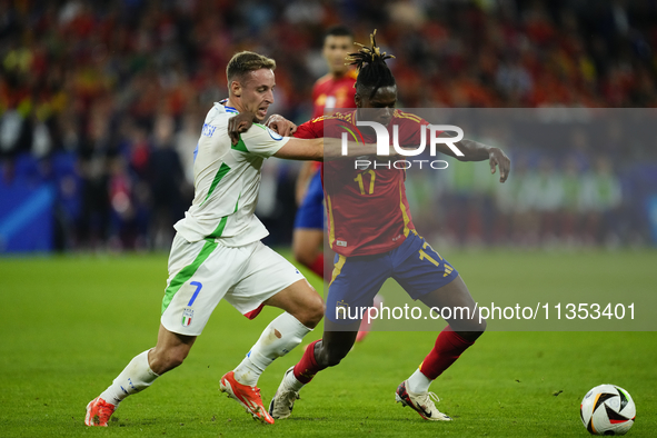 Davide Frattesi central midfield of Italy and Inter Milan and Nico Williams left winger of Spain and Athletic Club Bilbao compete for the ba...