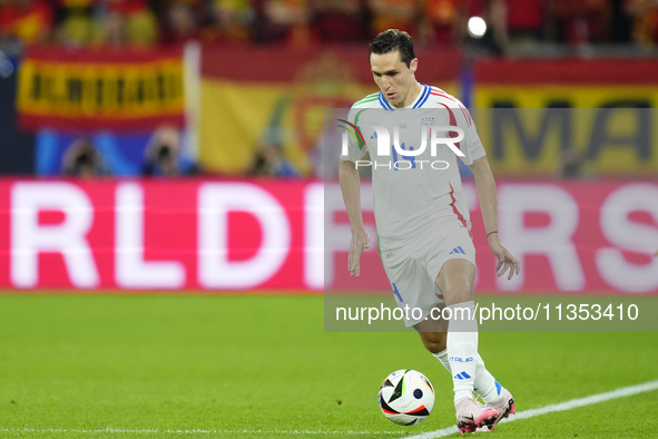 Federico Chiesa left winger of Italy and Juventus FC controls the ball during the UEFA EURO 2024 group stage match between Spain and Italy a...