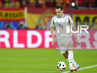 Federico Chiesa left winger of Italy and Juventus FC controls the ball during the UEFA EURO 2024 group stage match between Spain and Italy a...