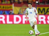 Federico Chiesa left winger of Italy and Juventus FC controls the ball during the UEFA EURO 2024 group stage match between Spain and Italy a...