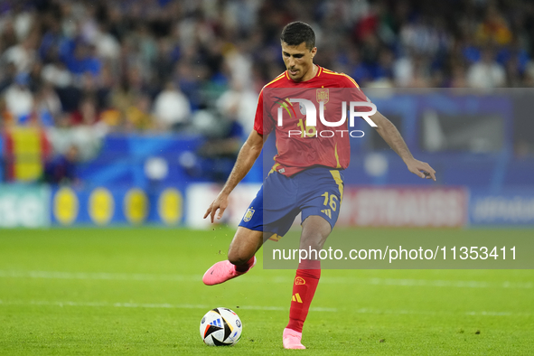 Rodrigo Hernandez defensive midfield of Spain and Manchester City during the UEFA EURO 2024 group stage match between Spain and Italy at Are...