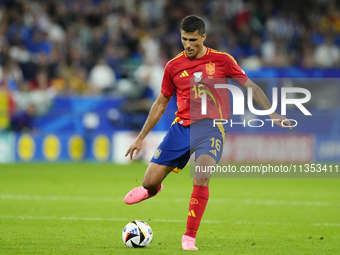 Rodrigo Hernandez defensive midfield of Spain and Manchester City during the UEFA EURO 2024 group stage match between Spain and Italy at Are...