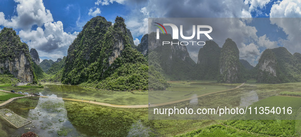 Vehicles are driving on a ''water highway'' formed by floods along a rural road in Chongzuo, China, on June 23, 2024. 