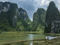 Vehicles are driving on a ''water highway'' formed by floods along a rural road in Chongzuo, China, on June 23, 2024. (