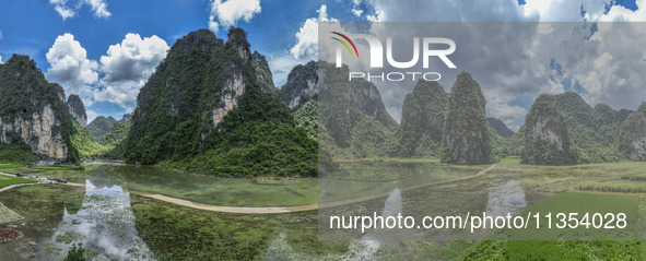 Vehicles are driving on a ''water highway'' formed by floods along a rural road in Chongzuo, China, on June 23, 2024. 