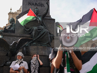 People attend solidarity with Palestine demonstration at the Main Square in Krakow, Poland on June 20th, 2024. (