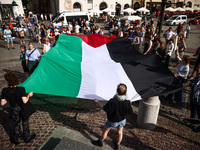 People attend solidarity with Palestine demonstration at the Main Square in Krakow, Poland on June 20th, 2024. (