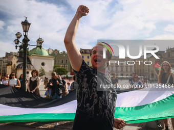 People attend solidarity with Palestine demonstration at the Main Square in Krakow, Poland on June 20th, 2024. (