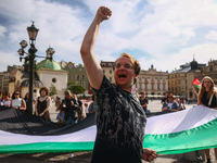 People attend solidarity with Palestine demonstration at the Main Square in Krakow, Poland on June 20th, 2024. (