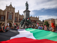 People attend solidarity with Palestine demonstration at the Main Square in Krakow, Poland on June 20th, 2024. (