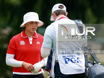 Amy Yang of Republic of Korea waits for her caddie to clean her ball during the final round of the KPMG Women's PGA Championship at Sahalee...