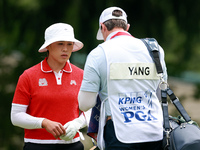 Amy Yang of Republic of Korea waits for her caddie to clean her ball during the final round of the KPMG Women's PGA Championship at Sahalee...