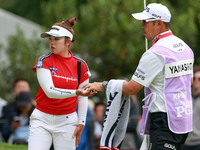 Miyu Yamashita of Japan takes her ball from her caddie on the 3rd green  during the final round of the KPMG Women's PGA Championship at Saha...