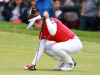 Miyu Yamashita of Japan places her ball on the 3rd green  during the final round of the KPMG Women's PGA Championship at Sahalee Country Clu...