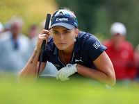 Lexi Thompson of Florida lines up her putt on the 3rd green during the final round of the KPMG Women's PGA Championship at Sahalee Country C...