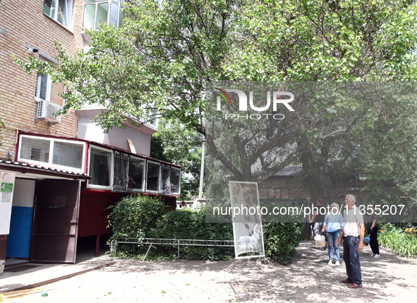 People are standing outside an apartment block after a Russian missile attack in Vasylkiv, Ukraine, on June 23, 2024. On Sunday morning, Jun...