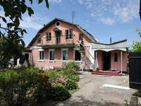 A woman is going down the stairs at a house damaged by a Russian missile attack in Vasylkiv, Ukraine, on June 23, 2024. On Sunday morning, J...