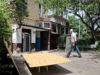 A man is walking outside an apartment block after a Russian missile attack in Vasylkiv, Ukraine, on June 23, 2024. On Sunday morning, June 2...