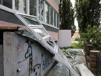 Knocked-out windows are lying on the ground outside an apartment block after a Russian missile attack in Vasylkiv, Ukraine, on June 23, 2024...