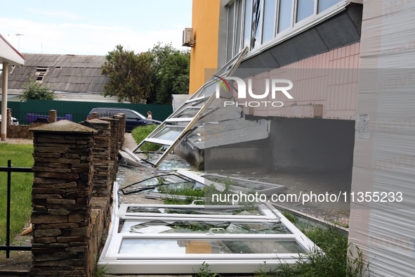 Knocked-out windows are lying on the ground outside an apartment block after a Russian missile attack in Vasylkiv, Ukraine, on June 23, 2024...