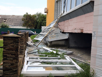 Knocked-out windows are lying on the ground outside an apartment block after a Russian missile attack in Vasylkiv, Ukraine, on June 23, 2024...