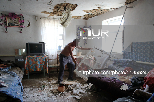 A man is removing the debris inside a house after a Russian missile attack in Vasylkiv, Ukraine, on June 23, 2024. On Sunday morning, June 2...