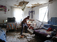 A man is removing the debris inside a house after a Russian missile attack in Vasylkiv, Ukraine, on June 23, 2024. On Sunday morning, June 2...