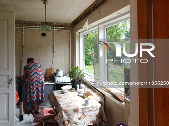 A woman is being seen inside a house damaged by a Russian missile attack in Vasylkiv, Ukraine, on June 23, 2024. On Sunday morning, June 23,...