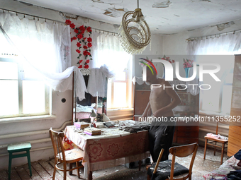 A man is being seen in a house damaged by a Russian missile attack in Vasylkiv, Ukraine, on June 23, 2024. On Sunday morning, June 23, anti-...