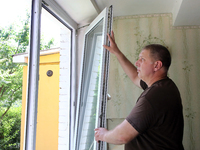 A man is examining a window in an apartment after a Russian missile attack in Vasylkiv, Ukraine, on June 23, 2024. On Sunday morning, June 2...