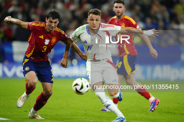 Robin Le Normand centre-back of Spain and Real Sociedad and Mateo Retegui centre-forward of Italy and Genoa CFC compete for the ball during...