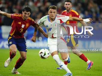 Robin Le Normand centre-back of Spain and Real Sociedad and Mateo Retegui centre-forward of Italy and Genoa CFC compete for the ball during...