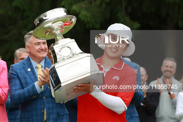 Amy Yang of Republic of Korea holds up the trophy after winning the KPMG Women's PGA Championship at Sahalee Country Club in Sammamish, Wash...