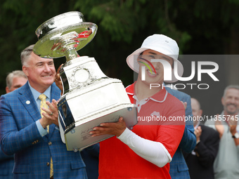 Amy Yang of Republic of Korea holds up the trophy after winning the KPMG Women's PGA Championship at Sahalee Country Club in Sammamish, Wash...