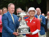 Amy Yang of Republic of Korea is presented with the trophy by the president of the PGA John Lindert after winning the KPMG Women's PGA Champ...