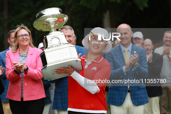 Amy Yang of Republic of Korea holds up the trophy after winning the KPMG Women's PGA Championship at Sahalee Country Club in Sammamish, Wash...