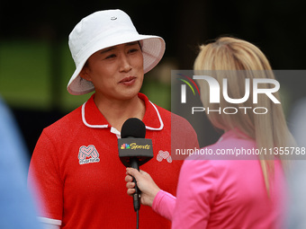 Amy Yang of Republic of Korea is interviewed during the awards ceremony after winning the KPMG Women's PGA Championship at Sahalee Country C...