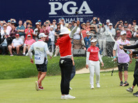 Amy Yang of Republic of Korea is showered with sparkling wine by her peers after winning the KPMG Women's PGA Championship at Sahalee Countr...