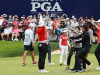 Amy Yang of Republic of Korea is showered with sparkling wine by her peers after winning the KPMG Women's PGA Championship at Sahalee Countr...