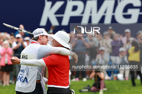 Amy Yang of Republic of Korea hugs her caddie after winning the KPMG Women's PGA Championship at Sahalee Country Club in Sammamish, Washingt...