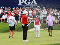 Amy Yang of Republic of Korea is showered with sparkling wine by her peers after winning the KPMG Women's PGA Championship at Sahalee Countr...