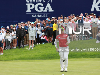 Miyu Yamashita of Japan lines up her putt on the 18th green during Day Four of the KPMG Women's PGA Championship at Sahalee Country Club in...