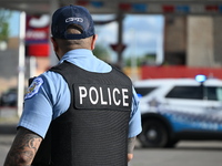 A Chicago Police Department officer is standing watch at the crime scene. Three people are being shot, with one person being pronounced dead...