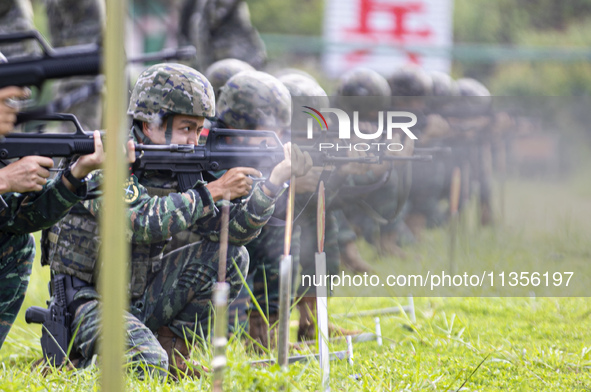 Special forces soldiers are performing an automatic rifle firing test on fixed targets in Baise, Guangxi province, China, on June 20, 2024. 