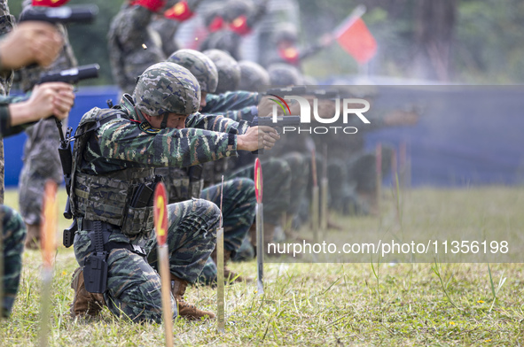 Special forces soldiers are performing an automatic rifle firing test on fixed targets in Baise, Guangxi province, China, on June 20, 2024. 