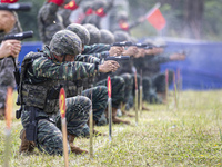 Special forces soldiers are performing an automatic rifle firing test on fixed targets in Baise, Guangxi province, China, on June 20, 2024....