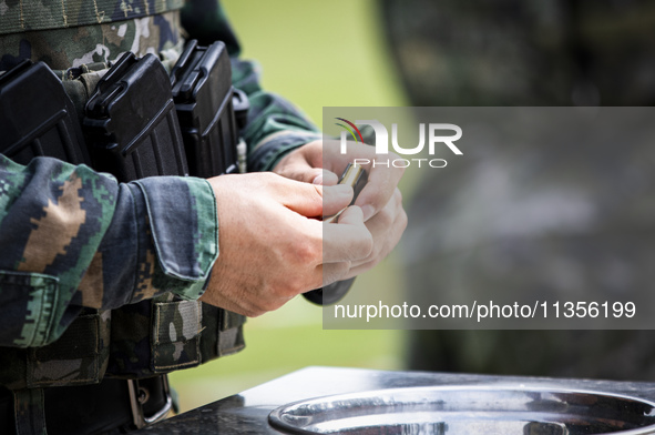 Special forces soldiers are performing an automatic rifle firing test on fixed targets in Baise, Guangxi province, China, on June 20, 2024. 