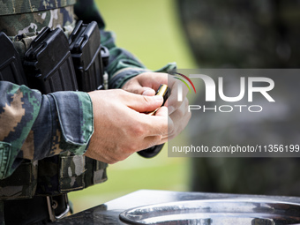 Special forces soldiers are performing an automatic rifle firing test on fixed targets in Baise, Guangxi province, China, on June 20, 2024....