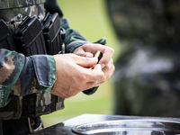 Special forces soldiers are performing an automatic rifle firing test on fixed targets in Baise, Guangxi province, China, on June 20, 2024....